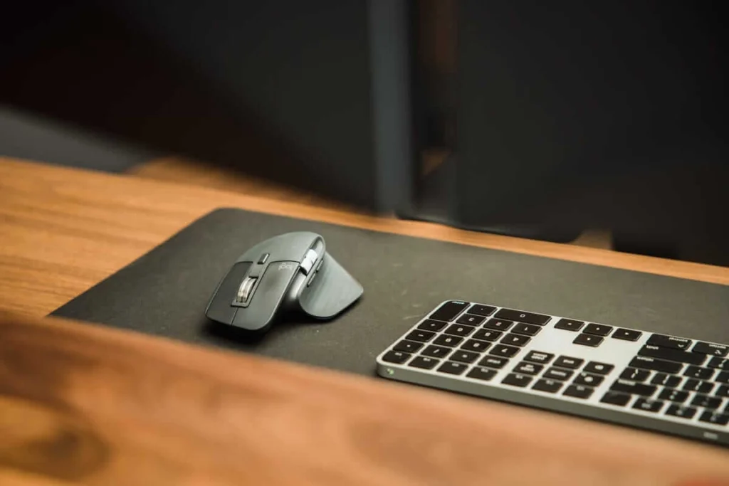 Logi Options+ software interface on a laptop screen showing customizable button settings for the Logitech MX Master 3S Wireless Mouse.