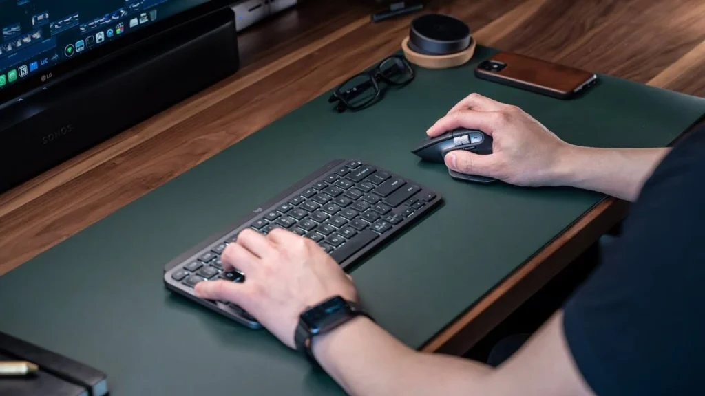Close-up of a Logitech MX Master 3S Wireless Mouse highlighting its side scroll wheel and customizable buttons for advanced productivity features.