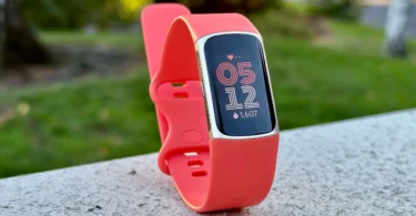 Fitbit Charge 6 fitness tracker on wrist showing health stats